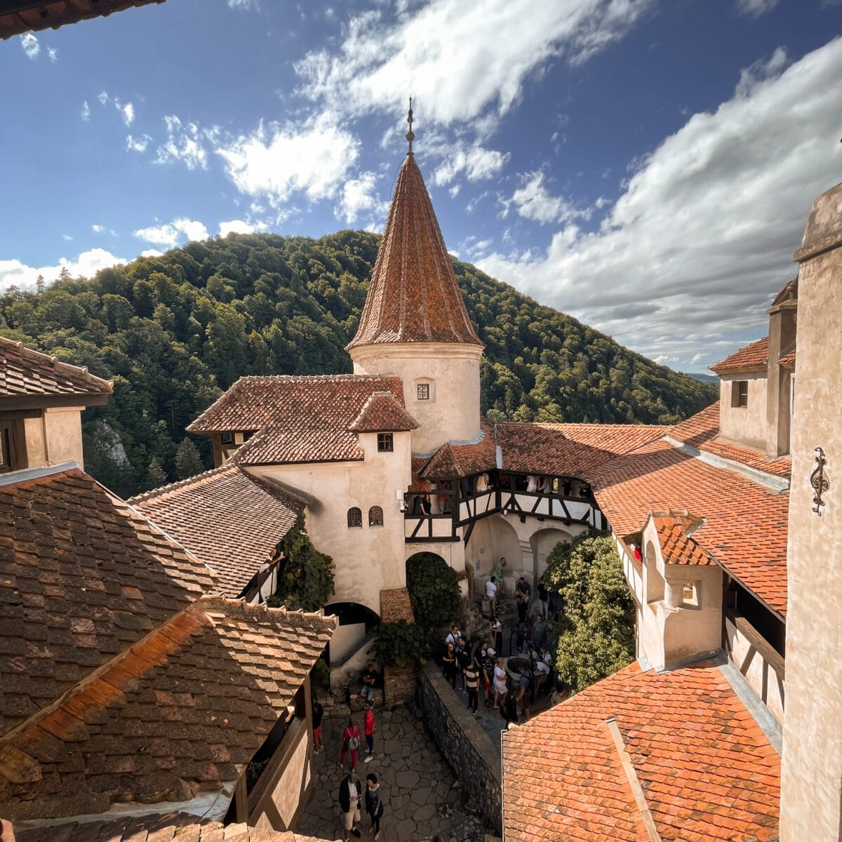 Orange roof of a gothic castle in the mountains of Transylvania, Romania