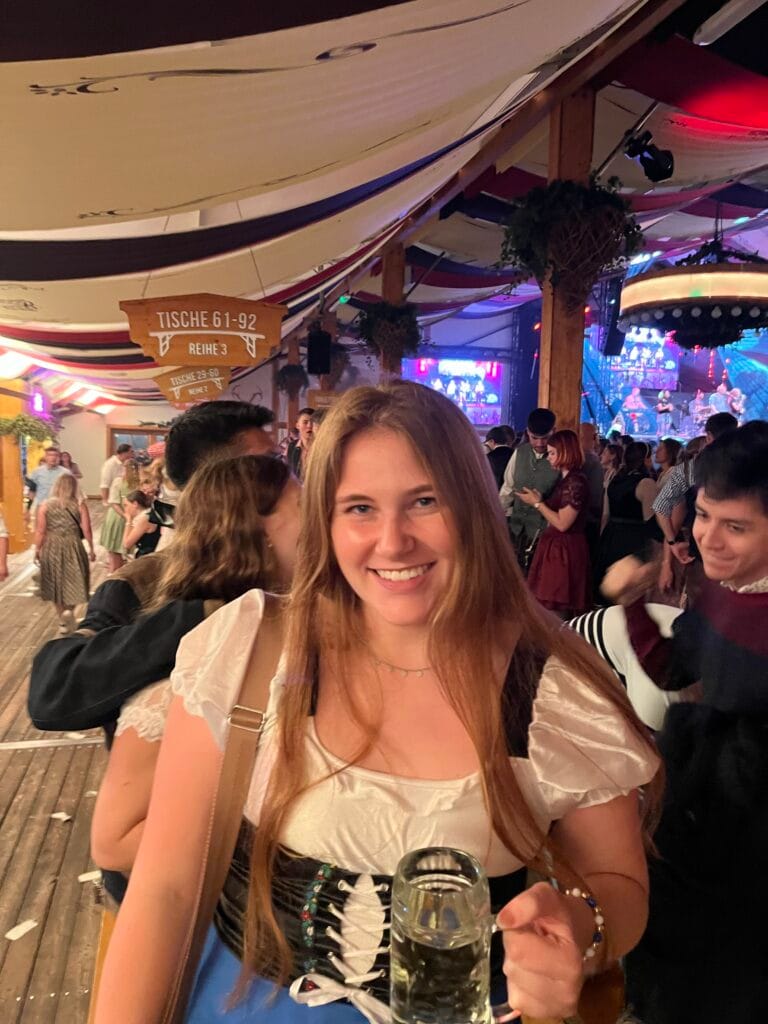 IMG_8868 Girl in dirndl with a beer stein in a festival tent